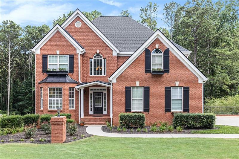 Image for property 7105 Weybridge Drive, Cumming, GA 30040
